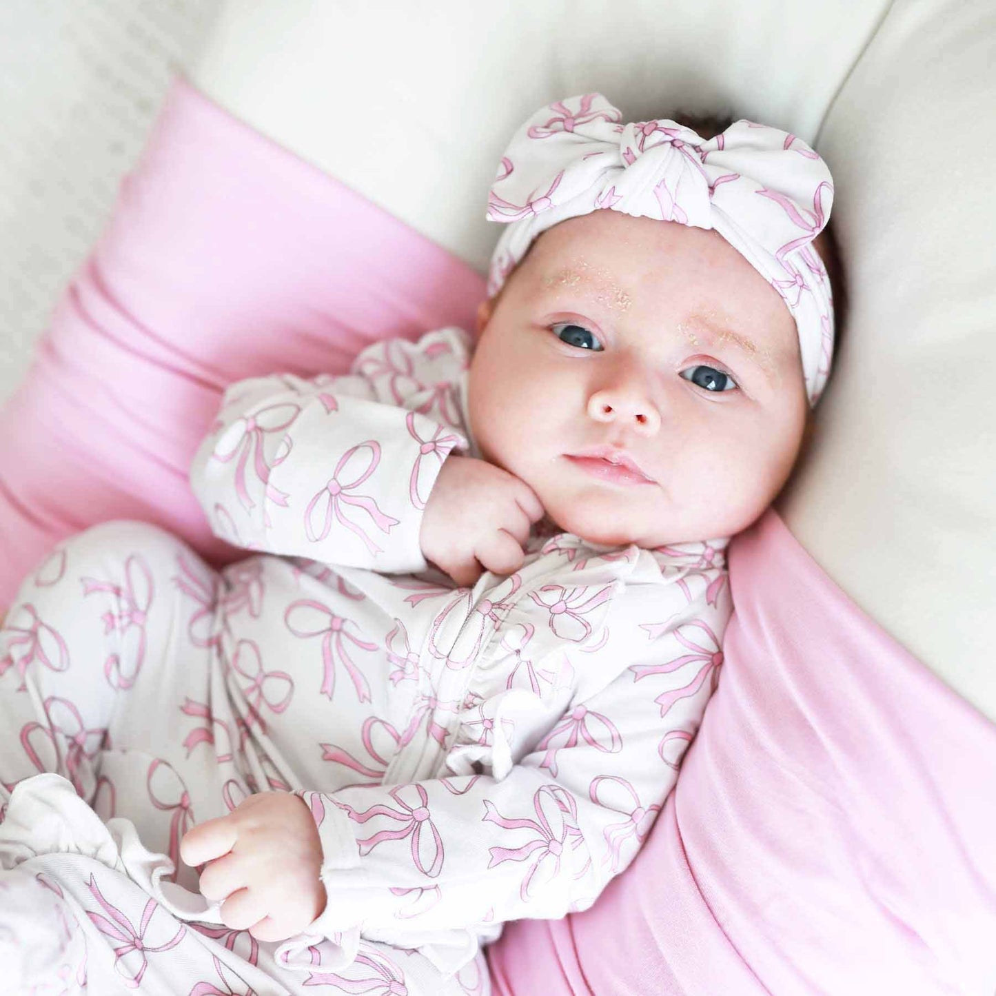 Blushing Bows Ruffle Zipper Footie