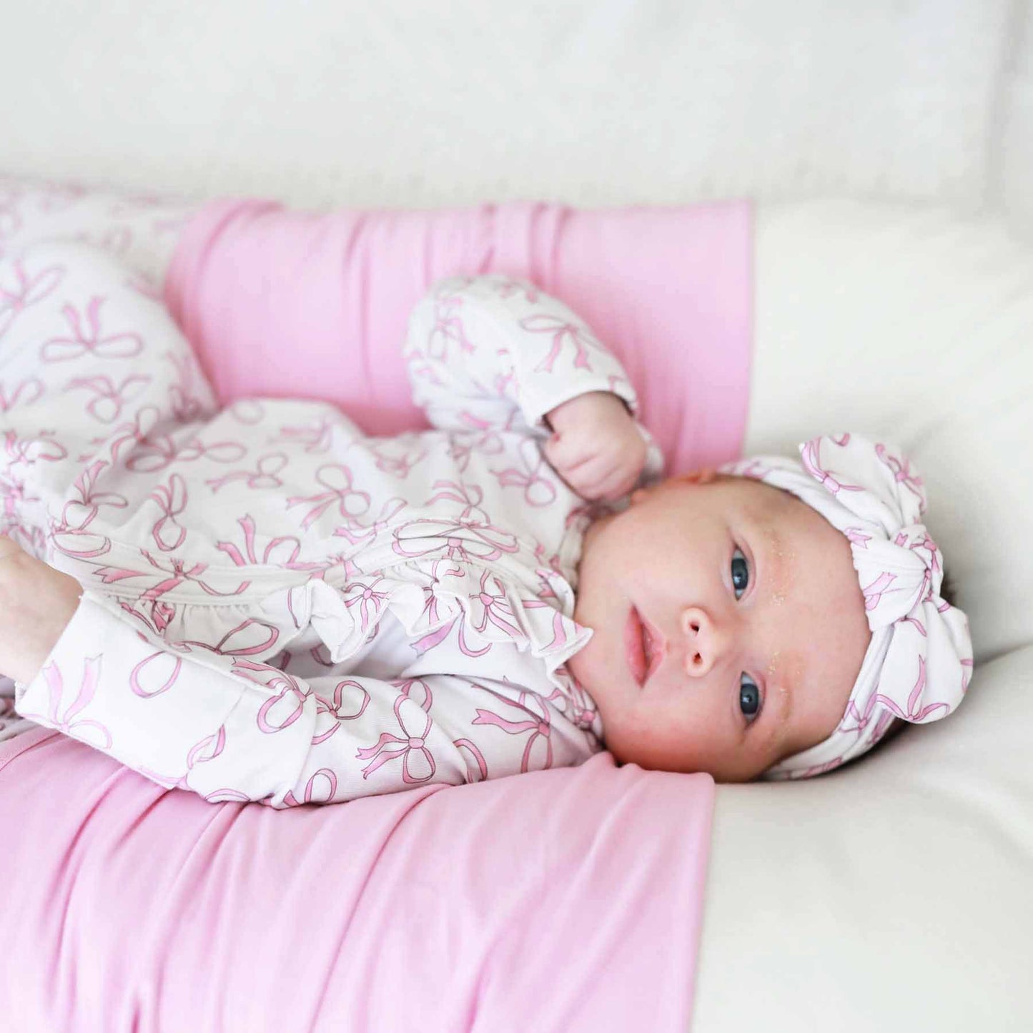 Blushing Bows Ruffle Zipper Footie